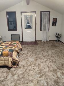 a bedroom with a bed and a painting on the wall