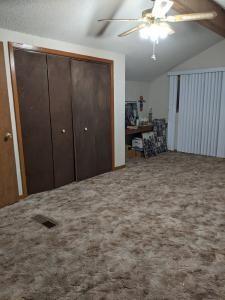 303 King Byron Road Scroggins, TX 75480 - Photo 8 of 11 a view of a livingroom with furniture and a ceiling fan