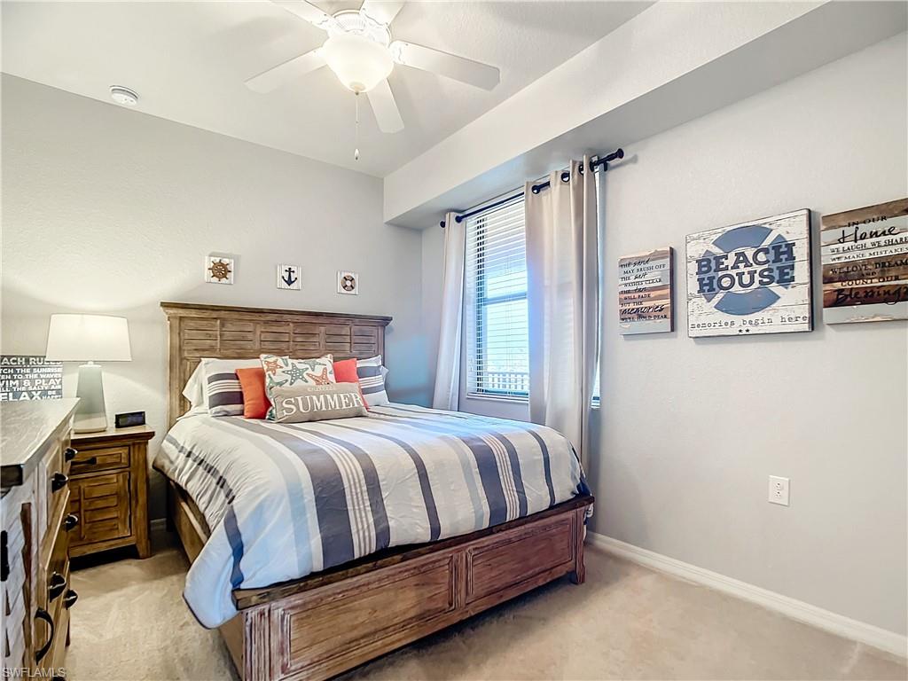 9715 Acqua Court, Unit 127 Naples, FL 34113 - Photo 38 of 50 a bedroom with a bed and a window
