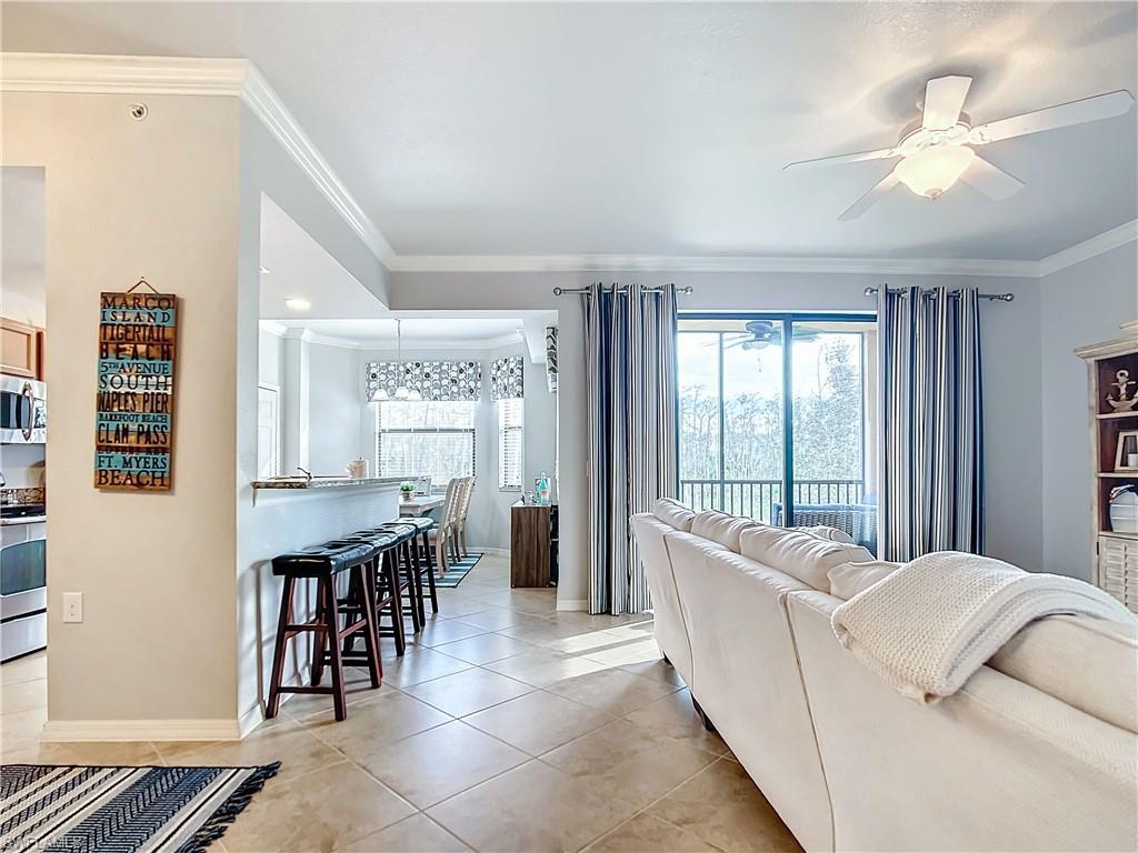9715 Acqua Court, Unit 127 Naples, FL 34113 - Photo 10 of 50 a living room with furniture and a window