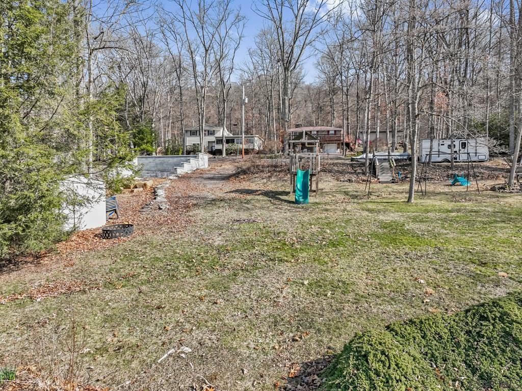 272 Braddocks Run Road Addison, PA 15411 - Photo 8 of 39 a view of a park with swings and slides