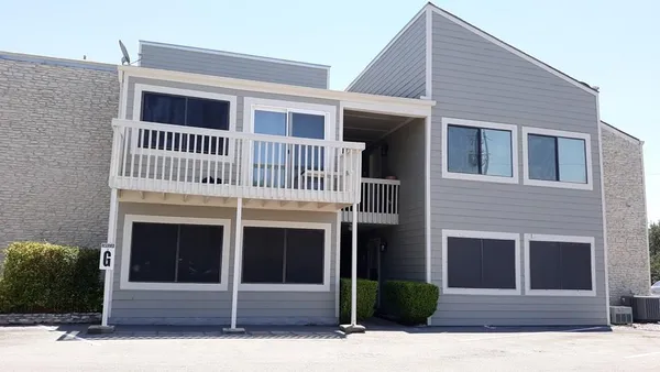 a front view of a house with garage