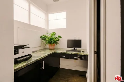 a kitchen with a sink and a stove top oven