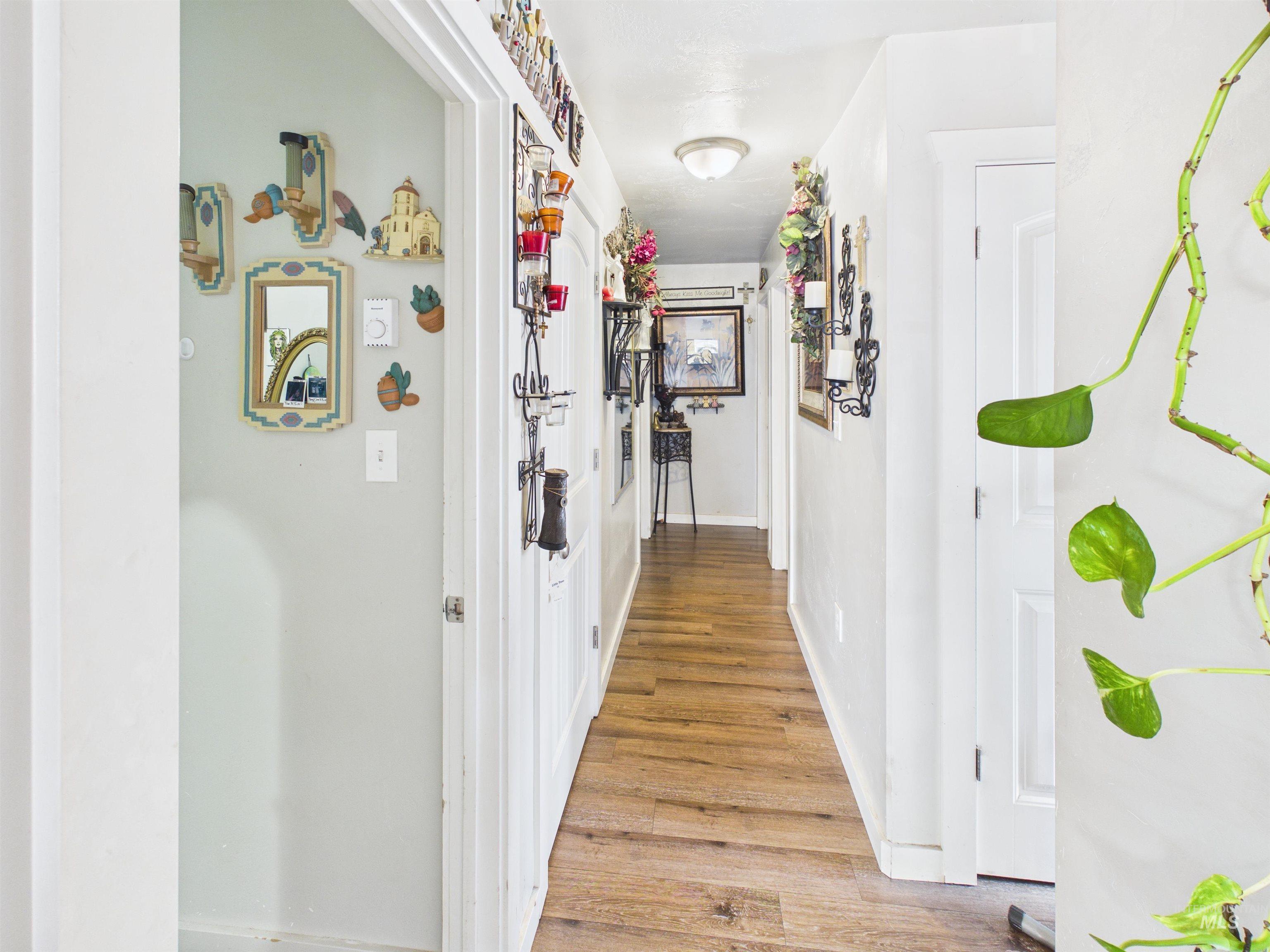 1618 Gingko Street, Unit 3 Rupert, ID 83350 - Photo 12 of 14 Hallway featuring light wood finished floors and baseboards