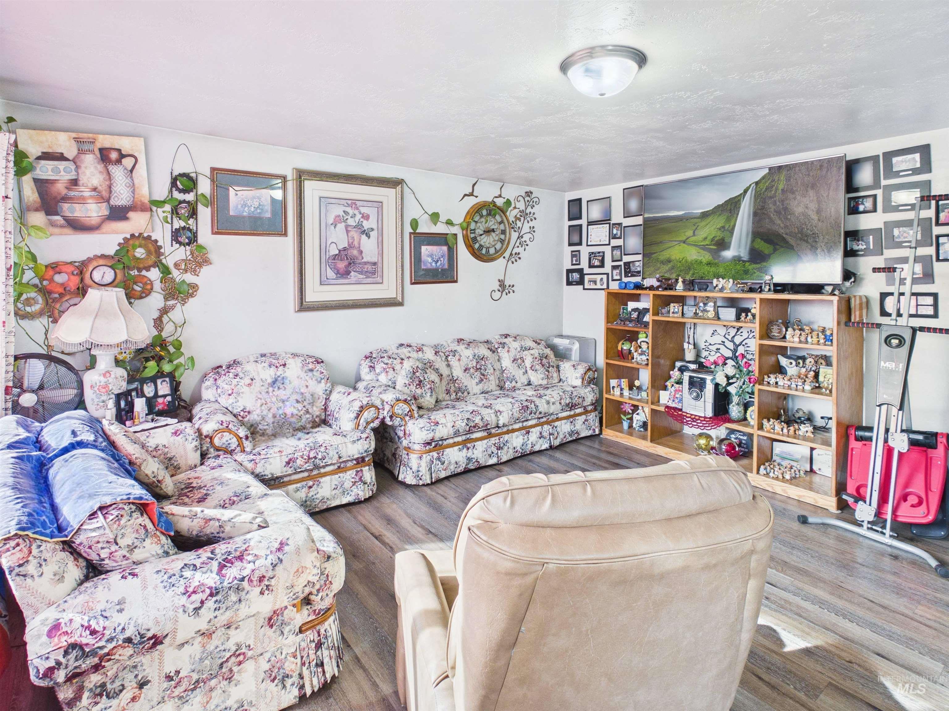 1618 Gingko Street, Unit 3 Rupert, ID 83350 - Photo 6 of 14 Living area with wood finished floors