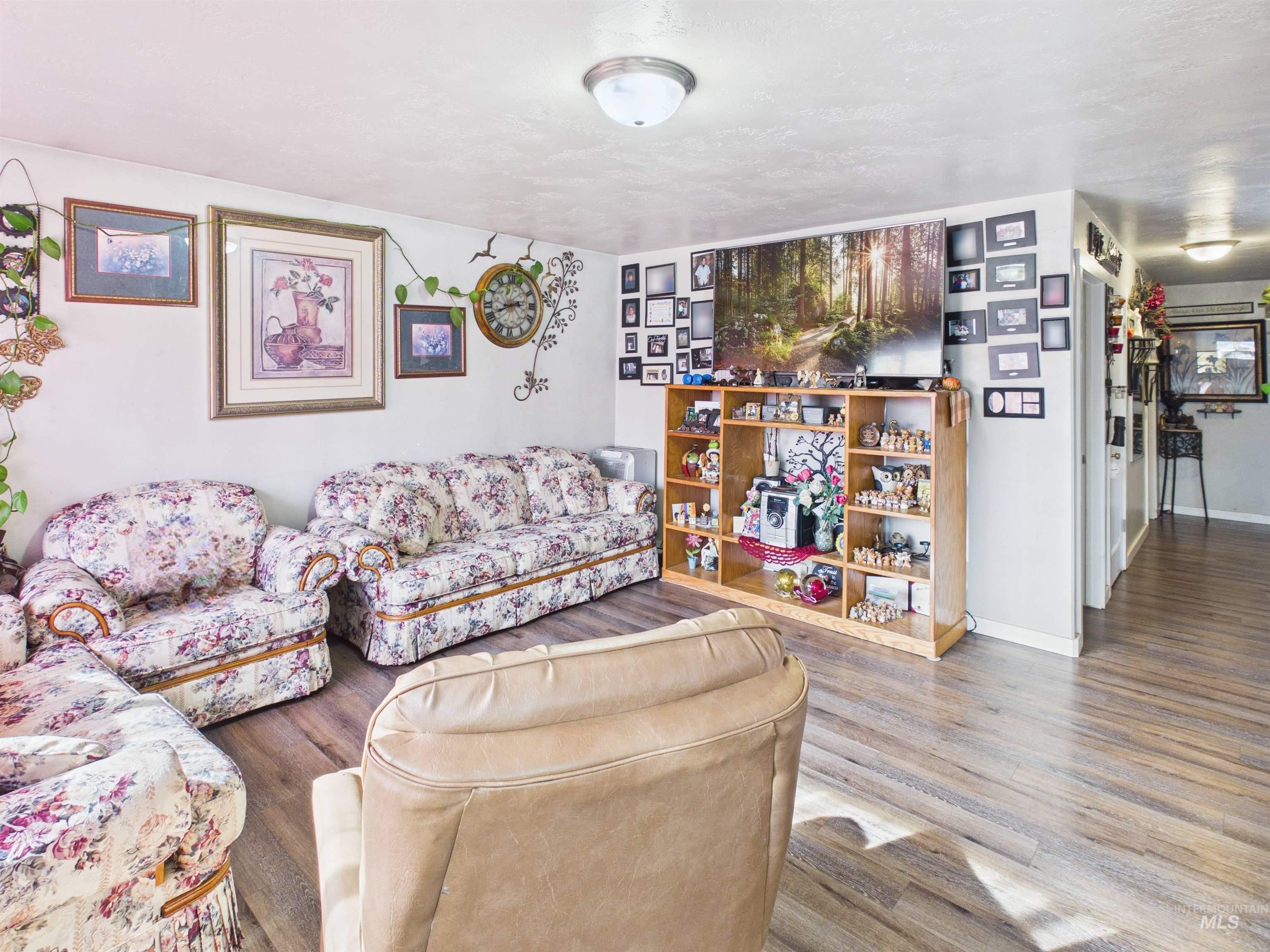 1618 Gingko Street, Unit 3 Rupert, ID 83350 - Photo 7 of 14 Living room featuring wood finished floors and baseboards
