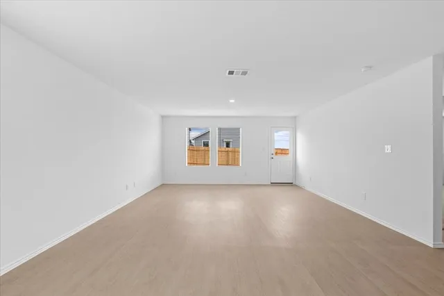 a kitchen with a sink and a mirror