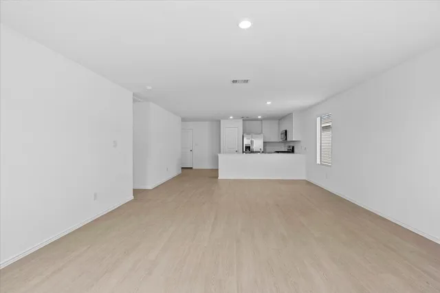 a view of a kitchen with white cabinets and sink