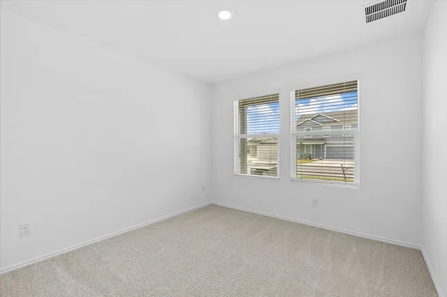 a bathroom with a toilet sink shower and mirror