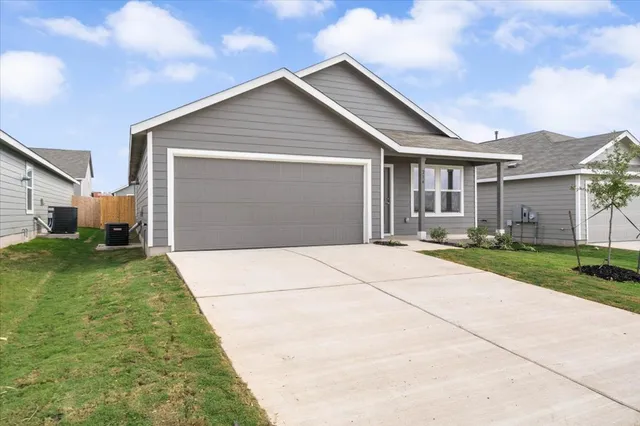 a backyard of a house with seating space