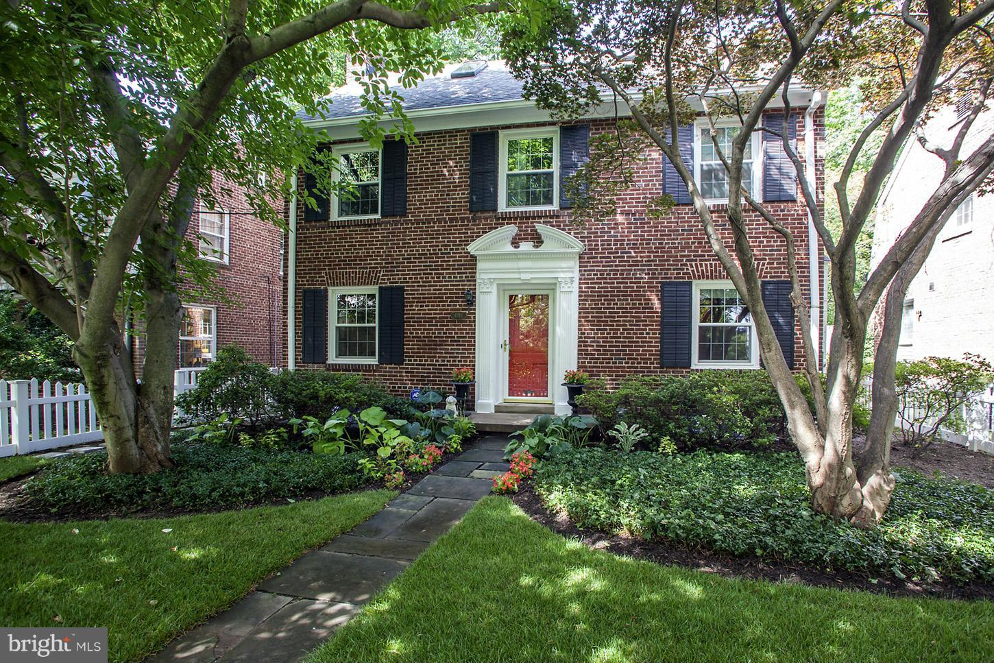 4312 Reno Road Northwest Washington, DC 20008 - Photo 2 of 29 front view of a house with a yard