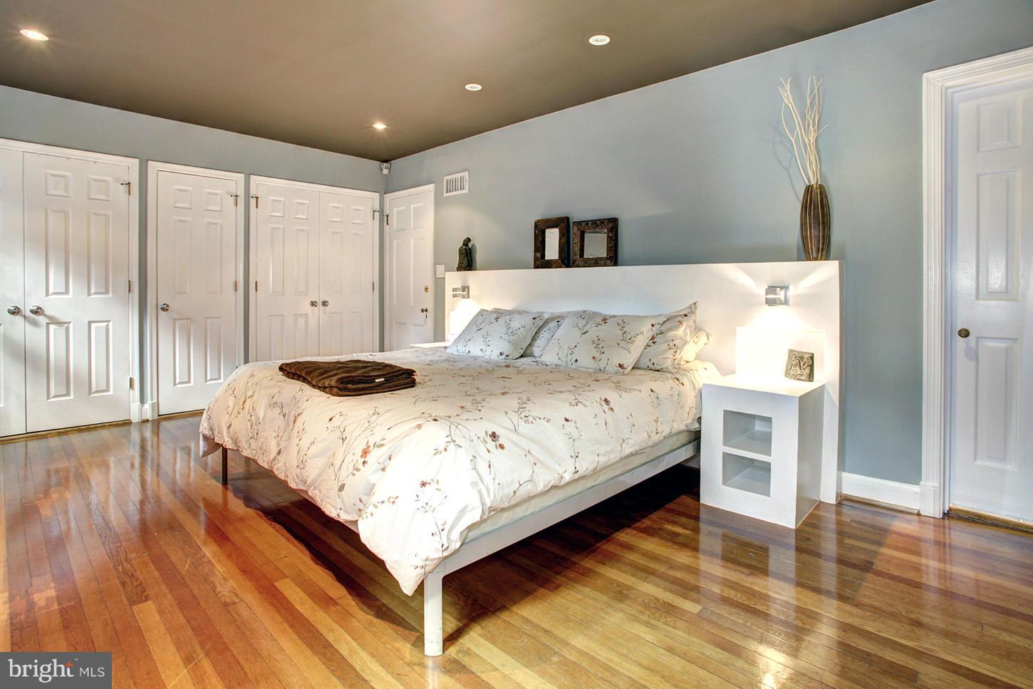 4312 Reno Road Northwest Washington, DC 20008 - Photo 14 of 29 a bedroom with a bed and a table