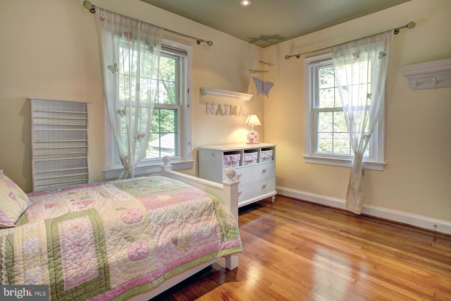4312 Reno Road Northwest Washington, DC 20008 - Photo 18 of 29 a bedroom with a bed and a window