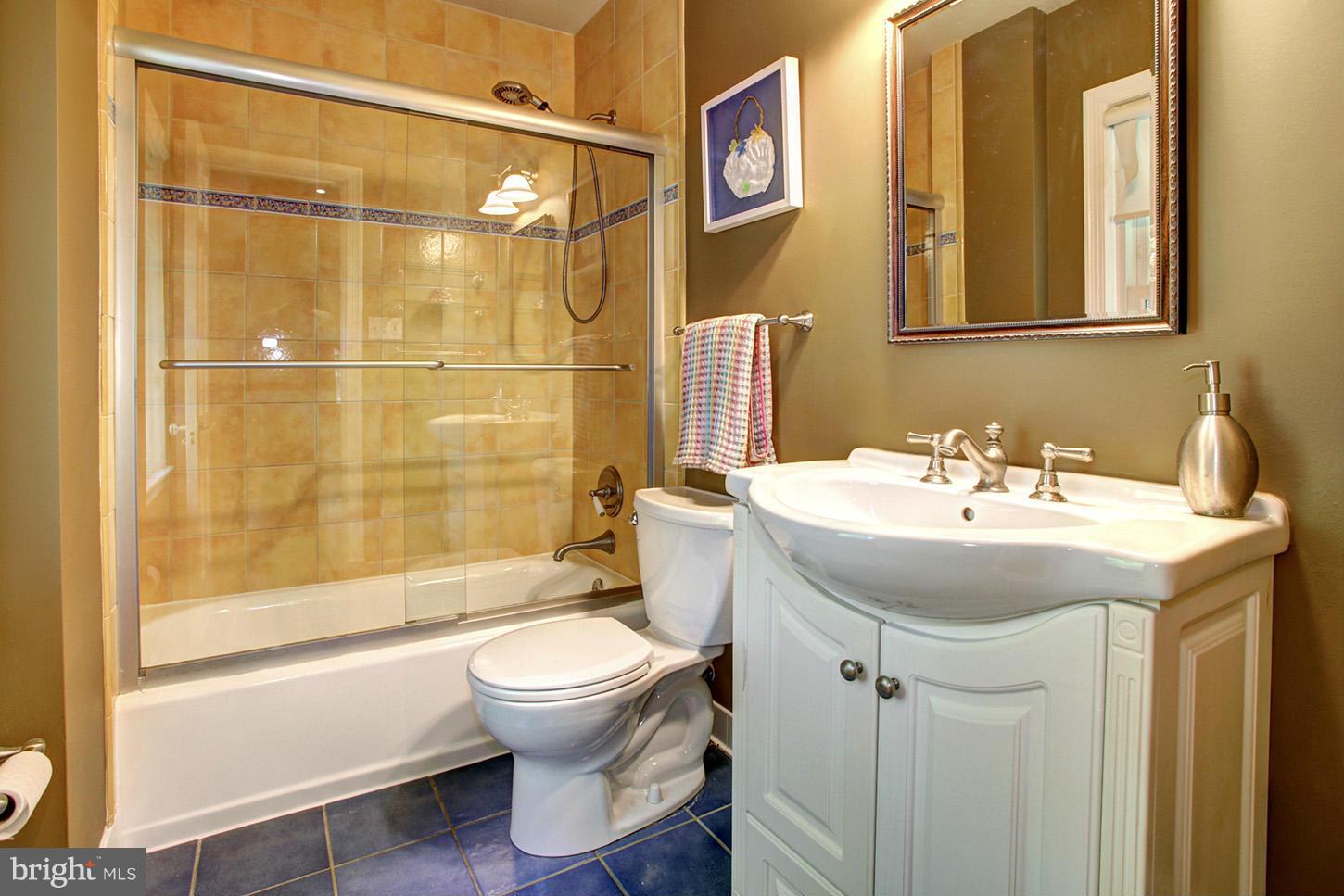 4312 Reno Road Northwest Washington, DC 20008 - Photo 19 of 29 a bathroom with a sink toilet and shower