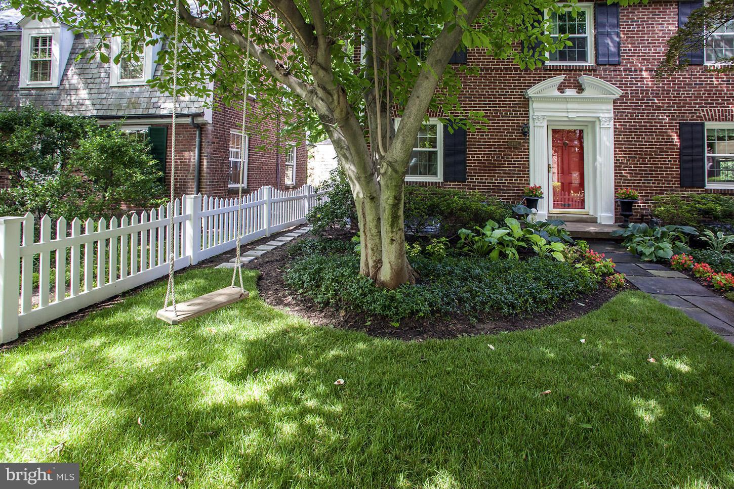 4312 Reno Road Northwest Washington, DC 20008 - Photo 3 of 29 a view of a house with a yard and plants