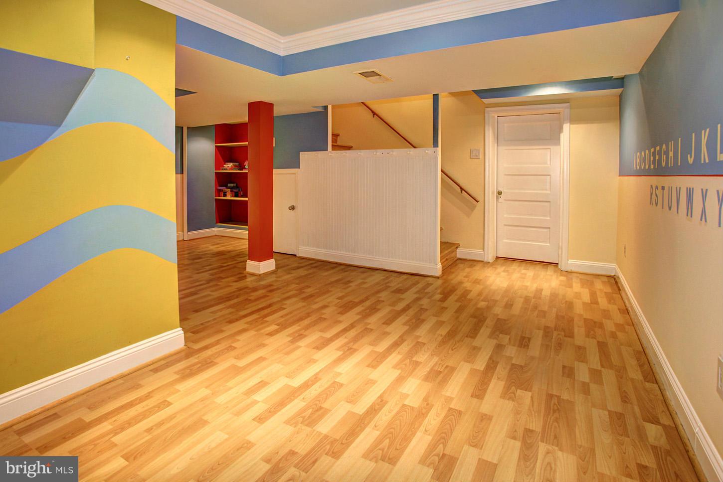 4312 Reno Road Northwest Washington, DC 20008 - Photo 22 of 29 a view of a bedroom with wooden floor and a cabinet