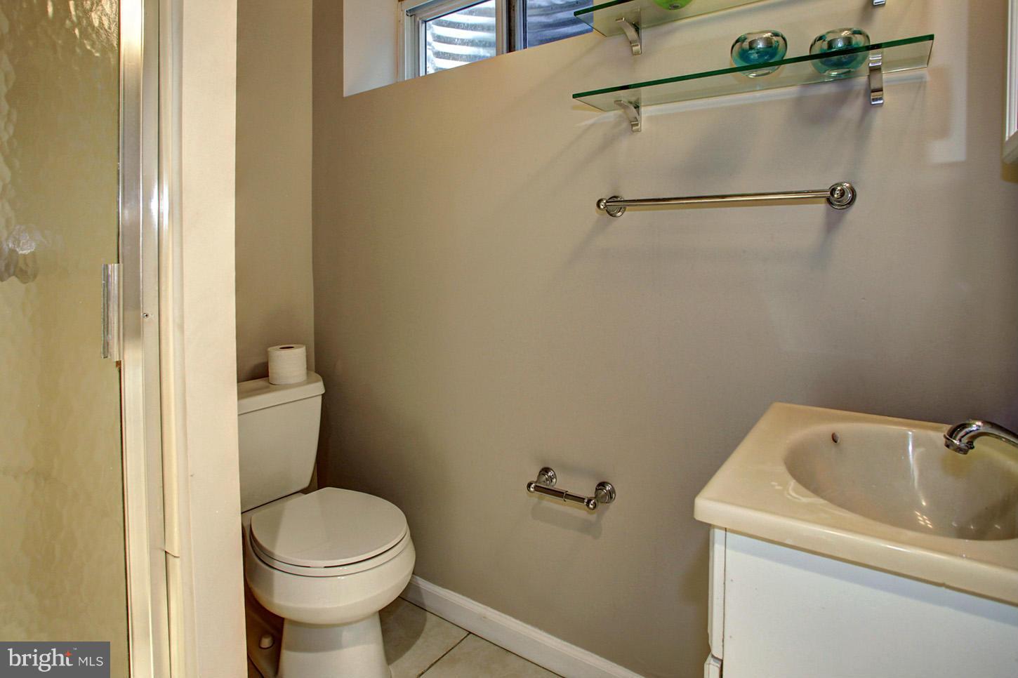 4312 Reno Road Northwest Washington, DC 20008 - Photo 25 of 29 a bathroom with a sink and toilet