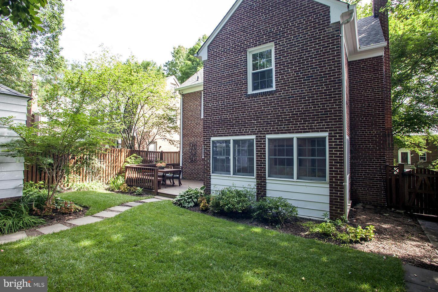 4312 Reno Road Northwest Washington, DC 20008 - Photo 29 of 29 a view of a house with a yard and plants
