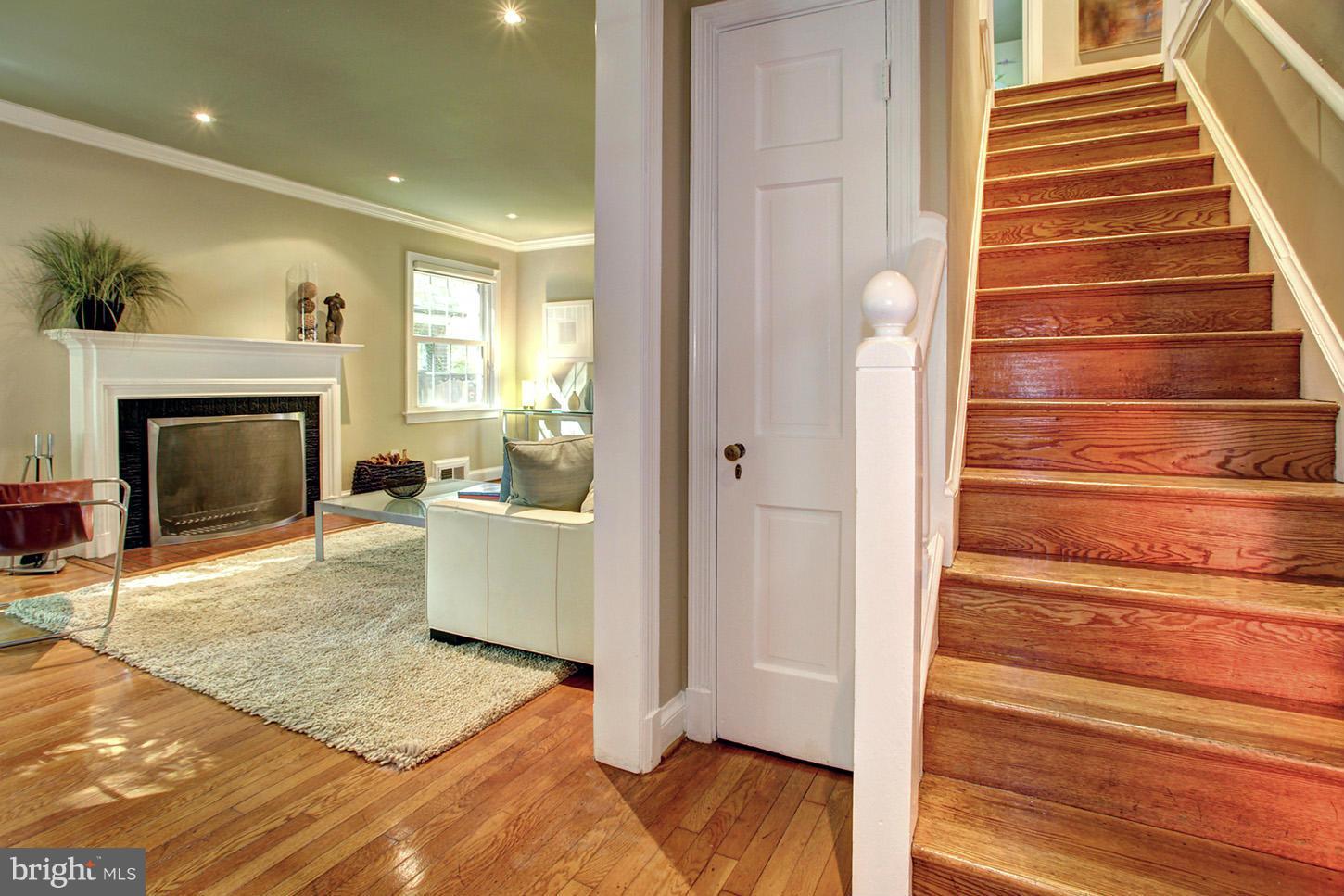 4312 Reno Road Northwest Washington, DC 20008 - Photo 4 of 29 a view of an entryway with wooden floor and a fireplace