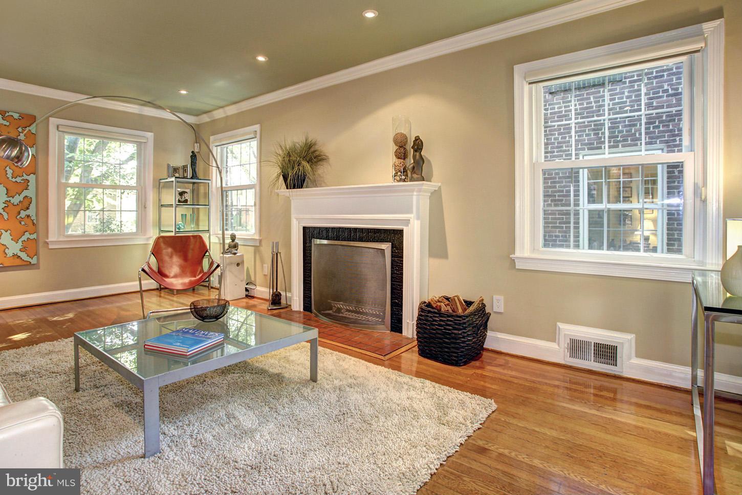 4312 Reno Road Northwest Washington, DC 20008 - Photo 7 of 29 a living room with furniture and a fireplace