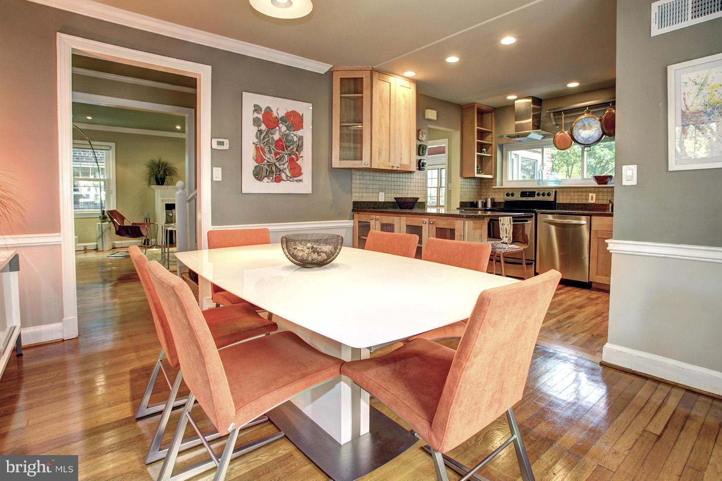 4312 Reno Road Northwest Washington, DC 20008 - Photo 9 of 29 a dining room with stainless steel appliances a dining table and chairs