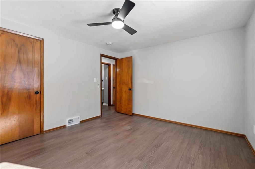 678 Colonial Manor Road Irwin, PA 15642 - Photo 11 of 30 a view of an empty room and wooden floor