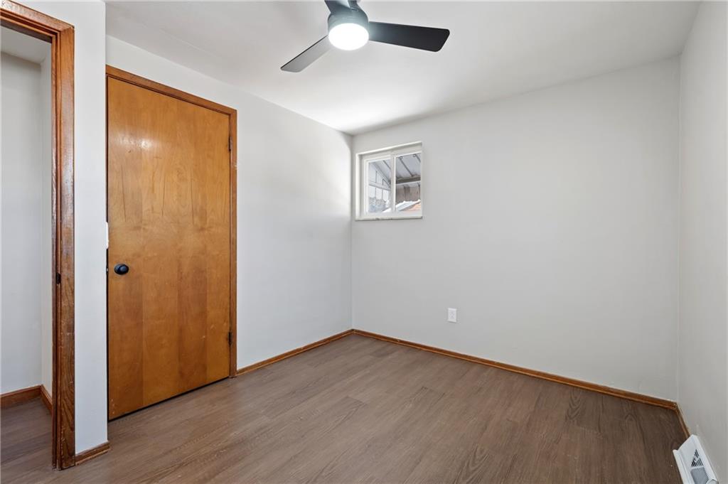 678 Colonial Manor Road Irwin, PA 15642 - Photo 14 of 30 wooden floor in an empty room
