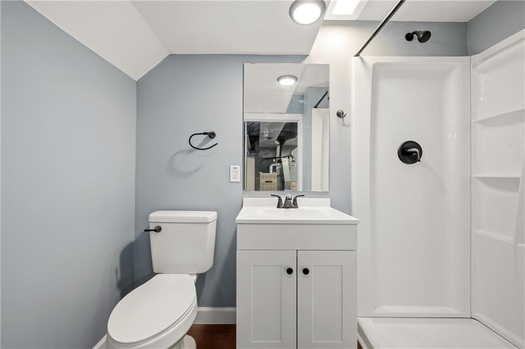 678 Colonial Manor Road Irwin, PA 15642 - Photo 20 of 30 a white toilet sitting next to a bathroom sink