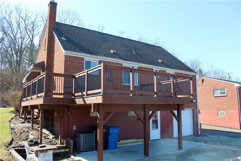 678 Colonial Manor Road Irwin, PA 15642 - Photo 23 of 26 a view of a house with wooden deck