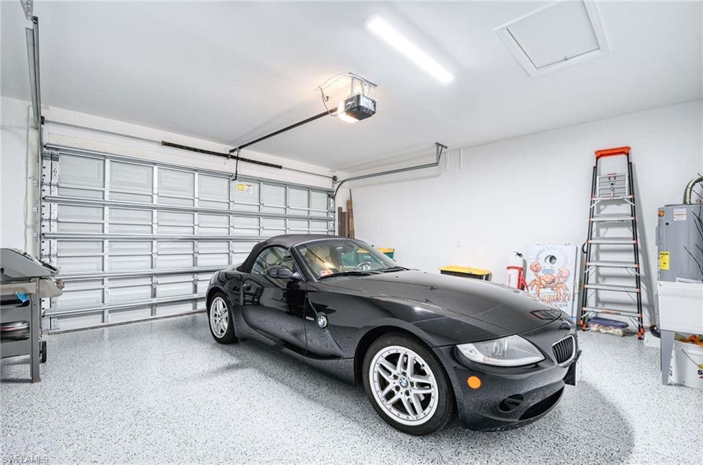 6984 Saona Court Naples, FL 34113 - Photo 34 of 47 2 CAR ATTACHED GARAGE