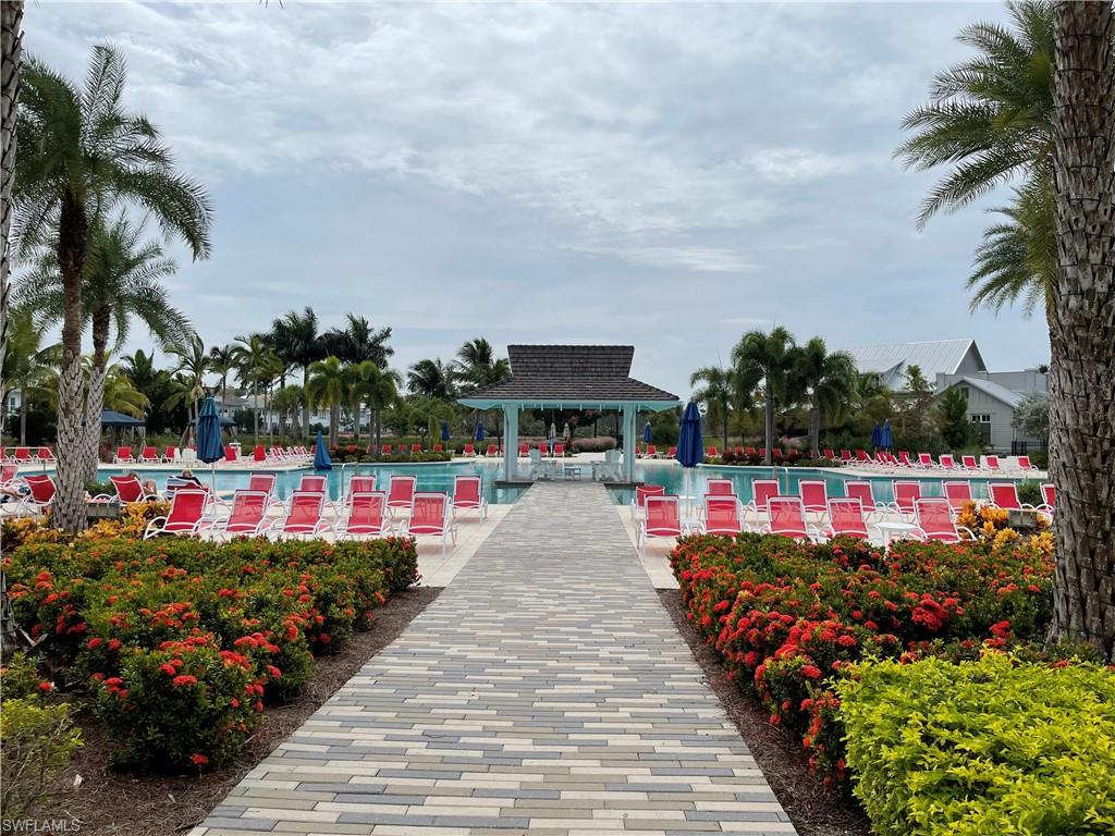 6984 Saona Court Naples, FL 34113 - Photo 39 of 47 COMMUNITY POOL AREA