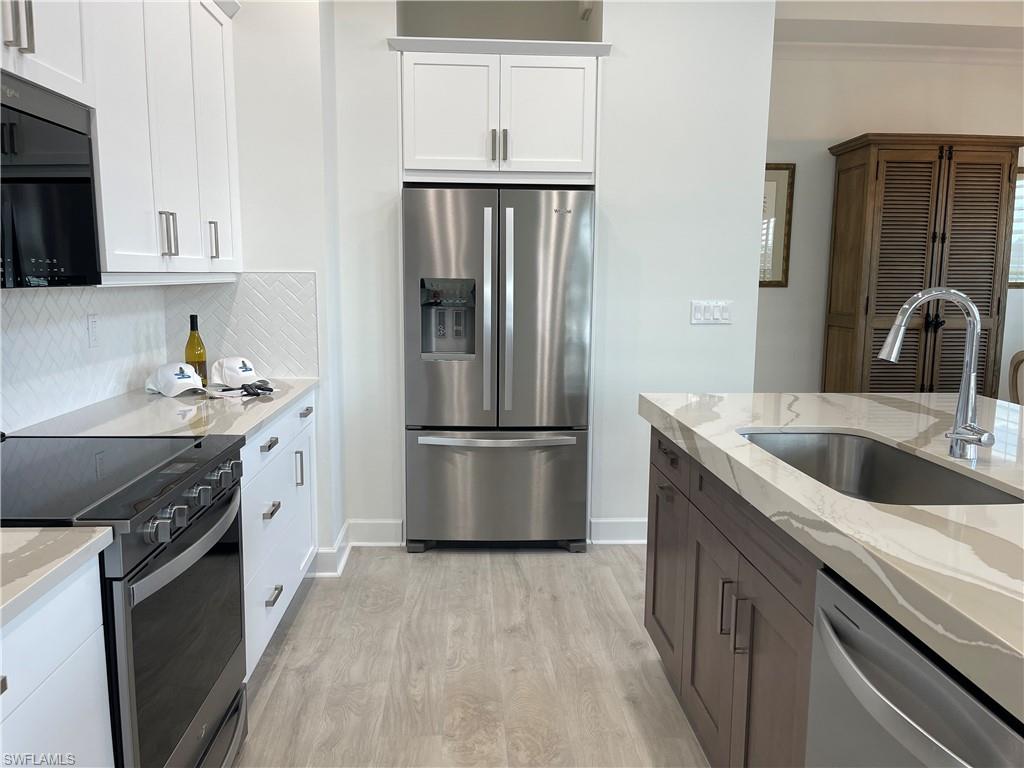 6984 Saona Court Naples, FL 34113 - Photo 8 of 47 STATE OF THE ART KITCHEN