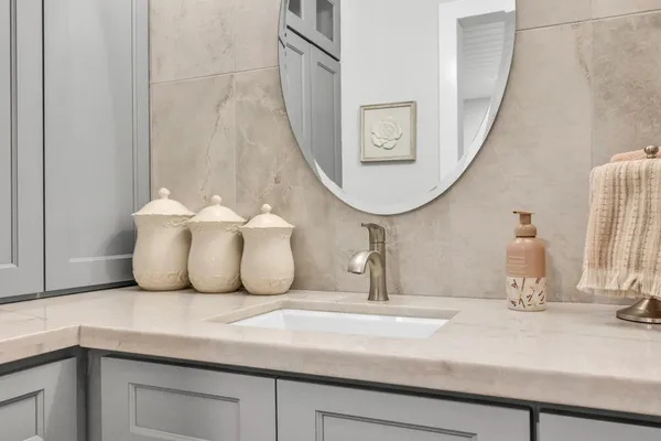 a bathroom with a sink and a mirror