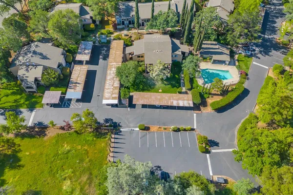 an aerial view of a house with a garden and plants