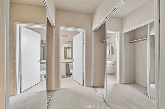 a view of a bathroom with a shower and a sink