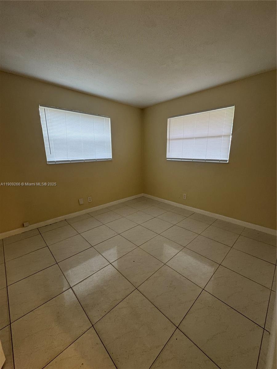 5700 Northwest 15th Street, Unit 2 Lauderhill, FL 33313 - Photo 3 of 7 a view of room and garage