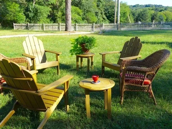 a view of a table and chairs in the garden