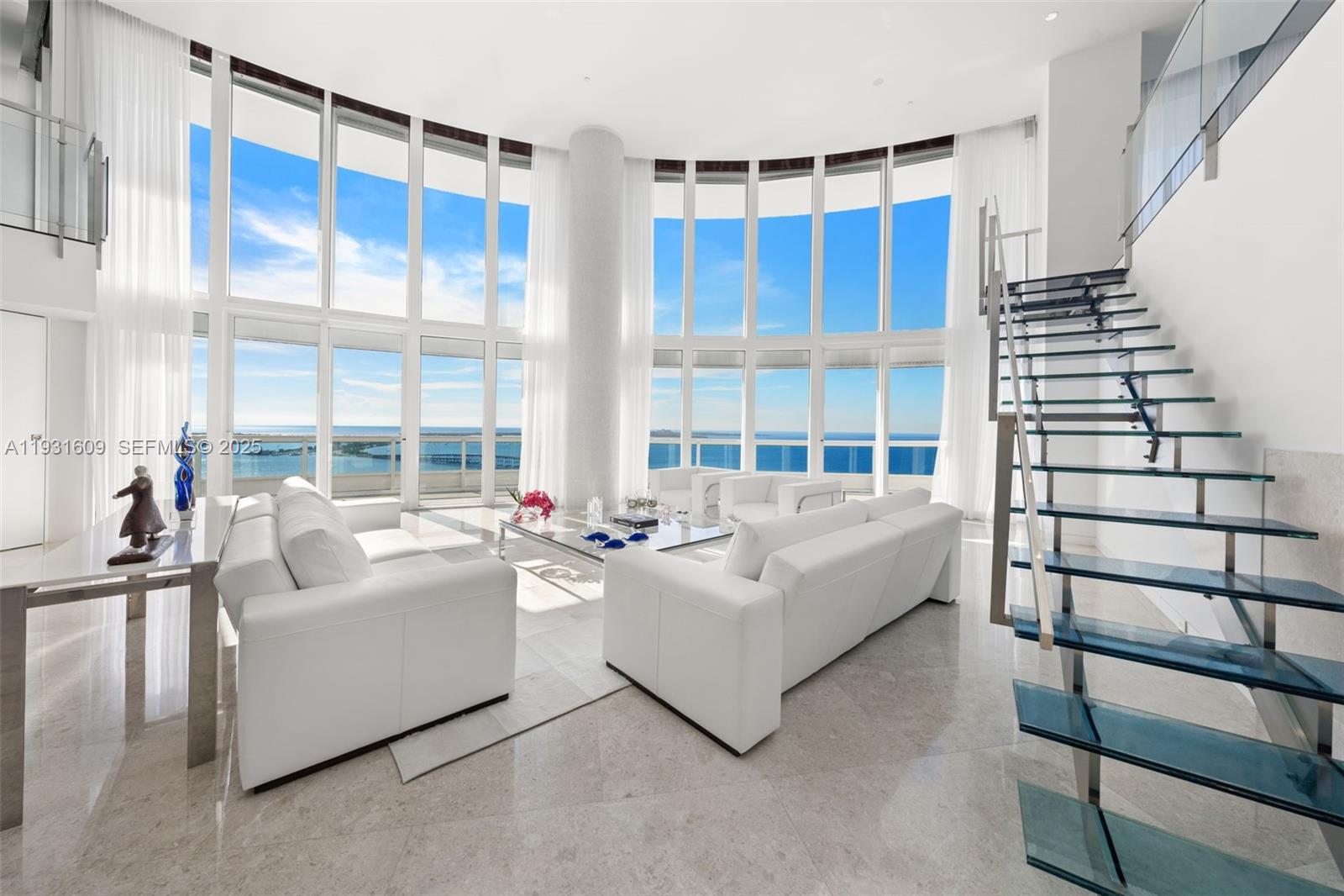 1643 Brickell Avenue, Unit 4102 Miami, FL 33129 - Photo 4 of 49 Living Room with custom designed glass and stainless steel staircase