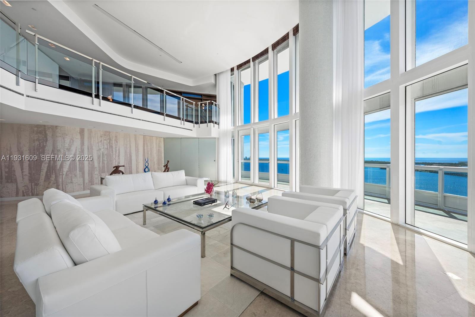 1643 Brickell Avenue, Unit 4102 Miami, FL 33129 - Photo 5 of 49 Living Room with customized mezzanine glass railing and frosted glass front door.