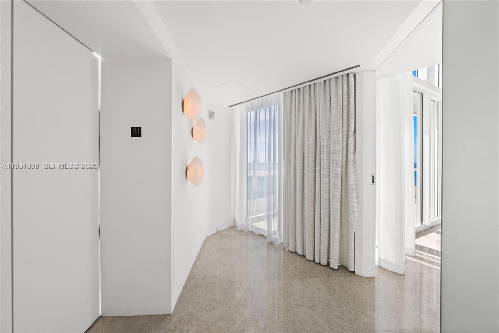 1643 Brickell Avenue, Unit 4102 Miami, FL 33129 - Photo 6 of 49 41st floor Private Elevator Foyer with double frosted glass front door opens up to a stunning Living Room with fantastic water views