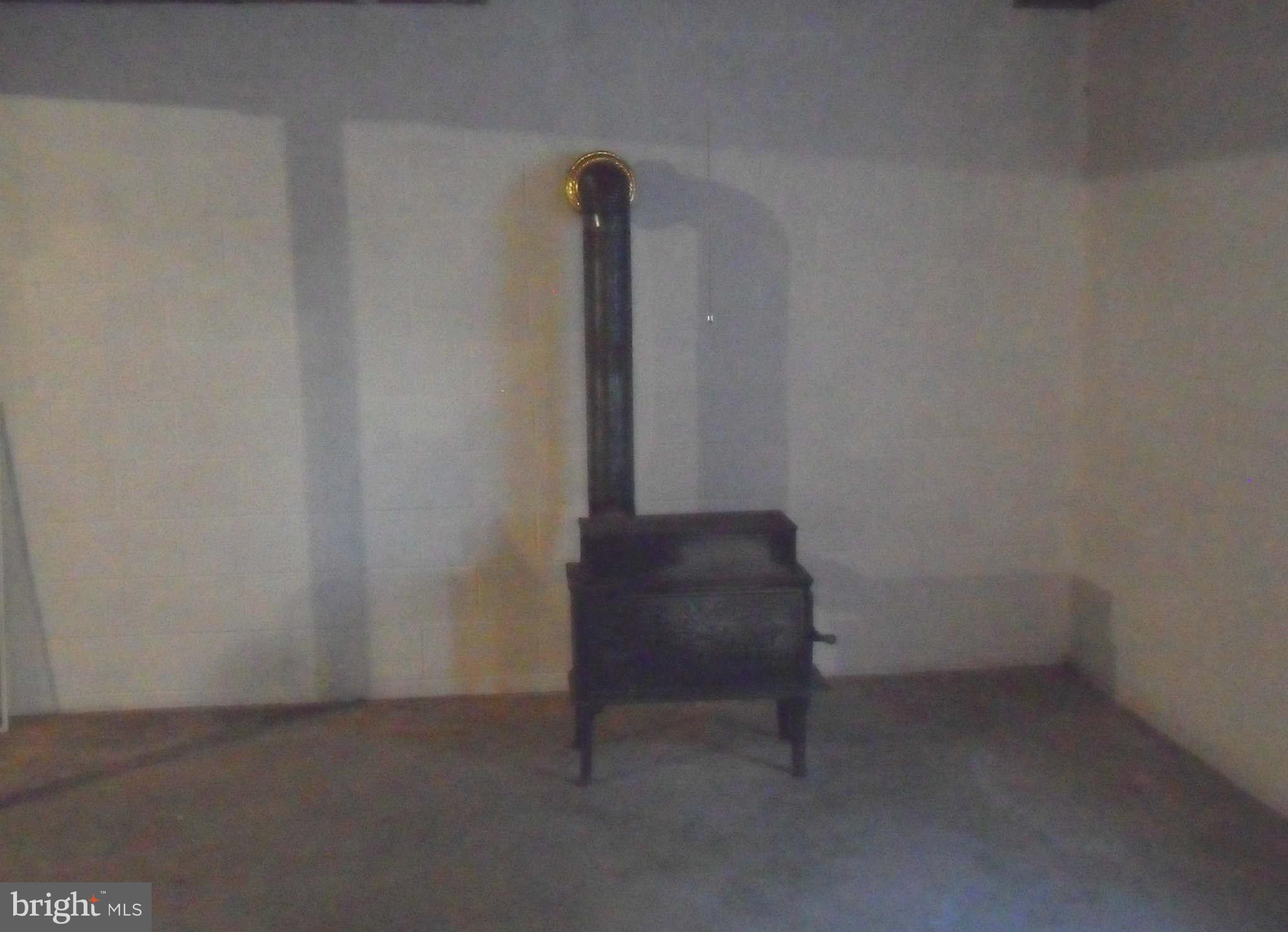 21297 Jacobs Ford Road Lignum, VA 22726 - Photo 21 of 26 wood stove in basement