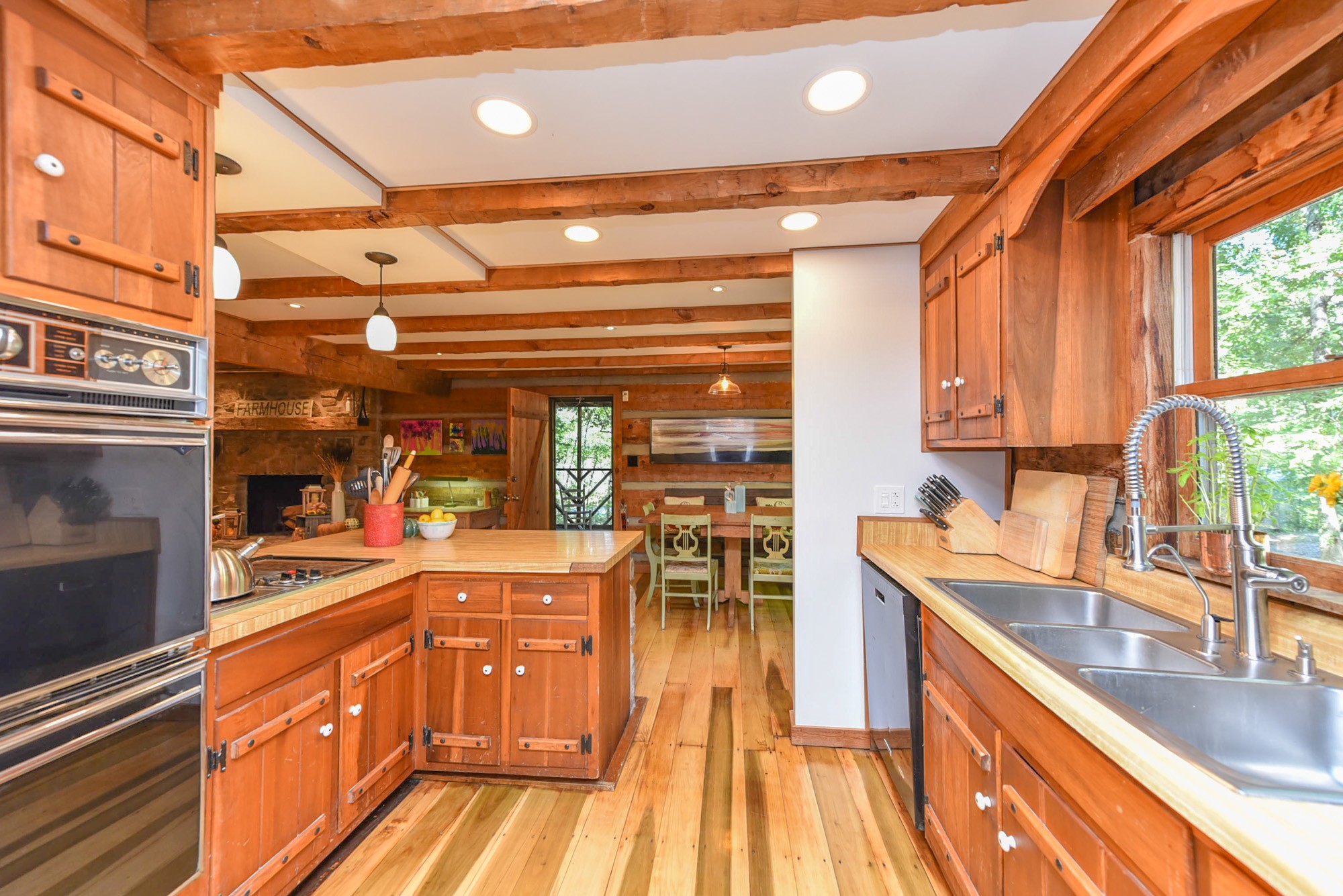 1630 Center Point Road Hendersonville, TN 37075 - Photo 14 of 46 a kitchen with stainless steel appliances granite countertop a sink and wooden cabinets