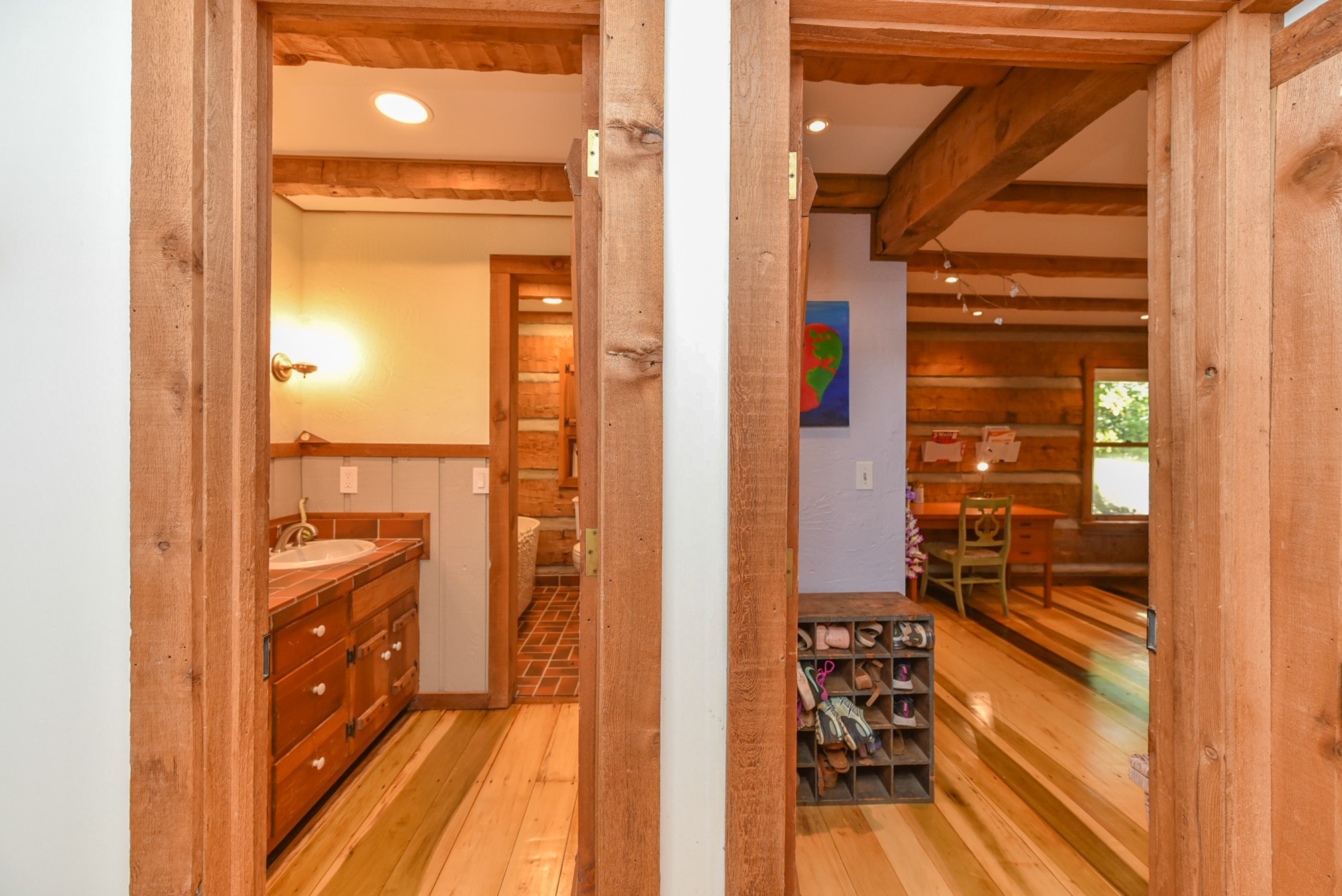 1630 Center Point Road Hendersonville, TN 37075 - Photo 25 of 46 a view of a hallway with wooden floor and a bathroom