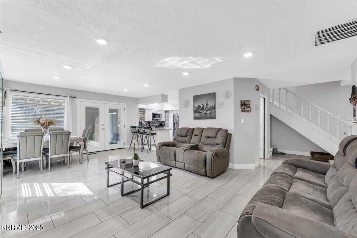 7194 Indigo Court Reno, NV 89506 - Photo 6 of 33 a living room with furniture and a table