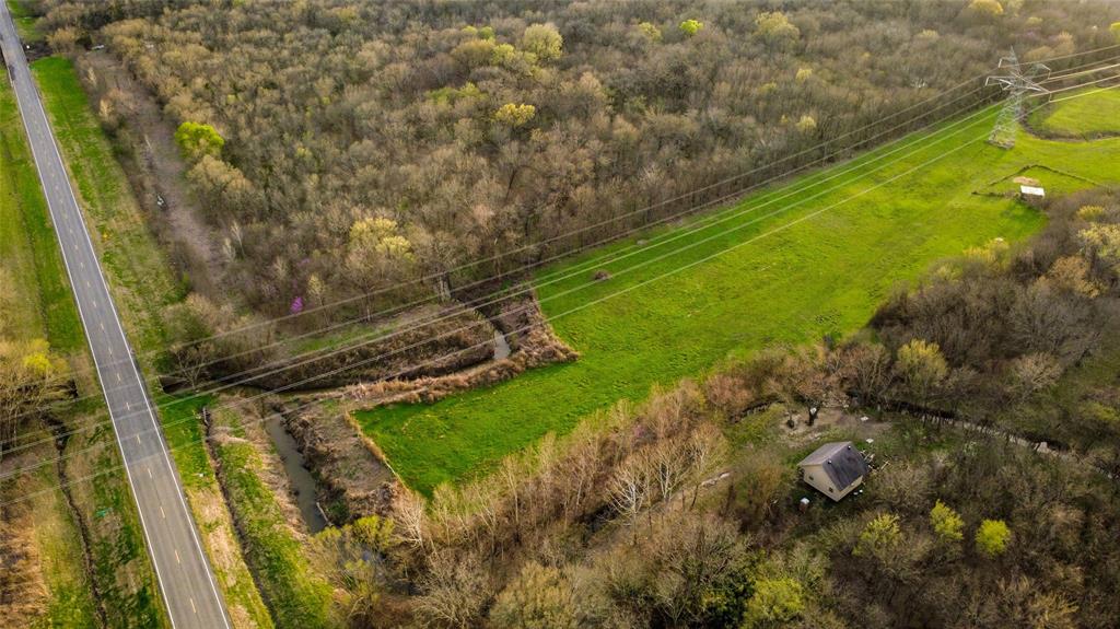 3218 St Commerce Tx 75428 Commerce, TX 75428 - Photo 3 of 8 a view of a golf course with a lake