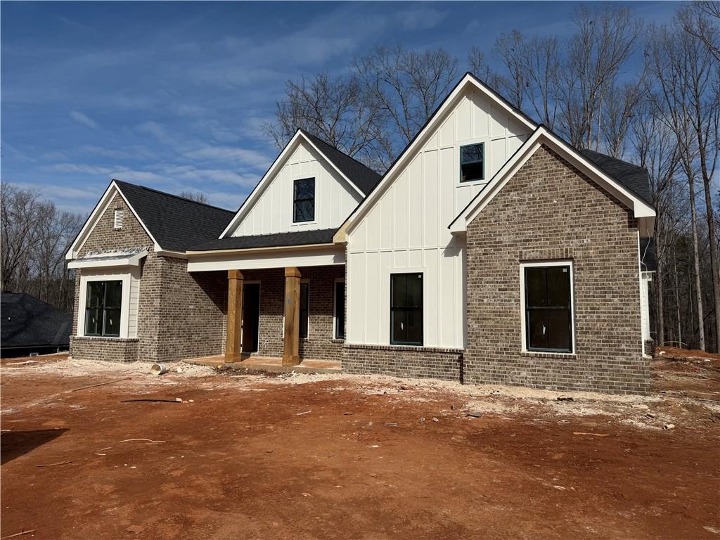 91 Lenten Rose Lane Pendergrass, GA 30567 - Photo 1 of 29 a front view of a house with a yard