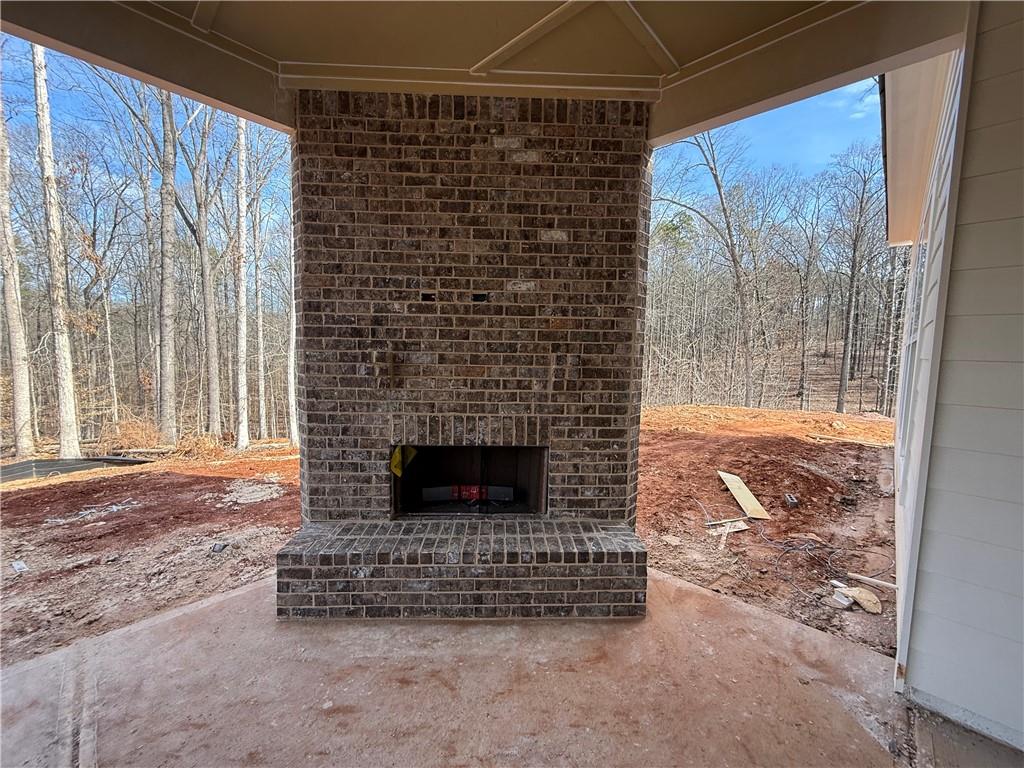91 Lenten Rose Lane Pendergrass, GA 30567 - Photo 11 of 29 a living room with a fireplace