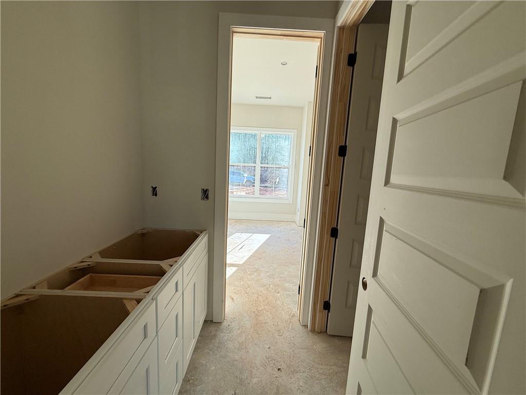 91 Lenten Rose Lane Pendergrass, GA 30567 - Photo 23 of 29 a kitchen with a refrigerator and a sink