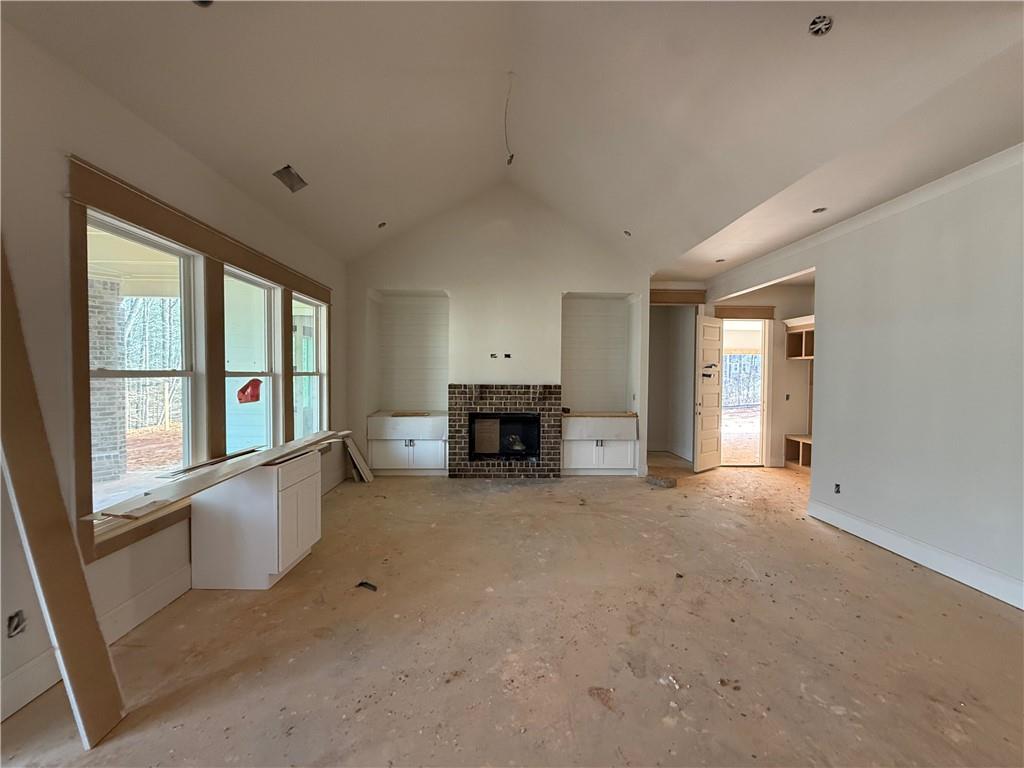 91 Lenten Rose Lane Pendergrass, GA 30567 - Photo 8 of 29 a view of an empty room with a fireplace