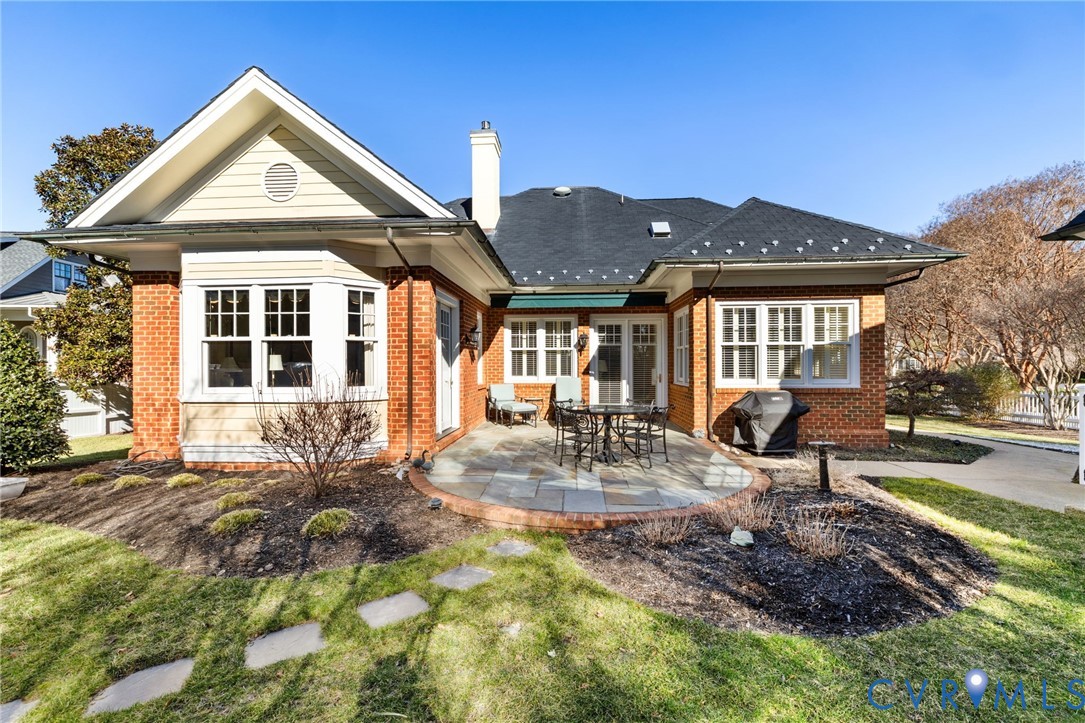 2730 Live Oak Lane Midlothian, VA 23113 - Photo 30 of 31 Rear view of house with brick siding, a patio, a y